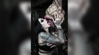 Goth slut kissing waste dump monster