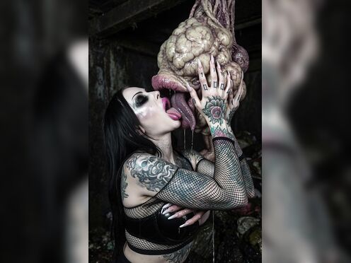Goth slut kissing waste dump monster